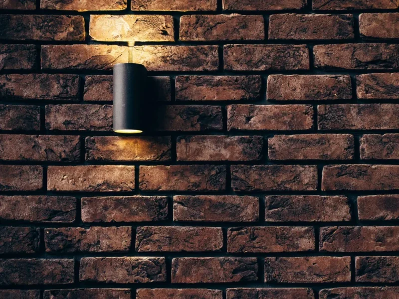 Contemporary brick wall design featuring a sleek accent light.